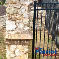Limestone Fence After - Patriot SoftWash