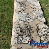 Limestone Wall Before - Patriot SoftWash